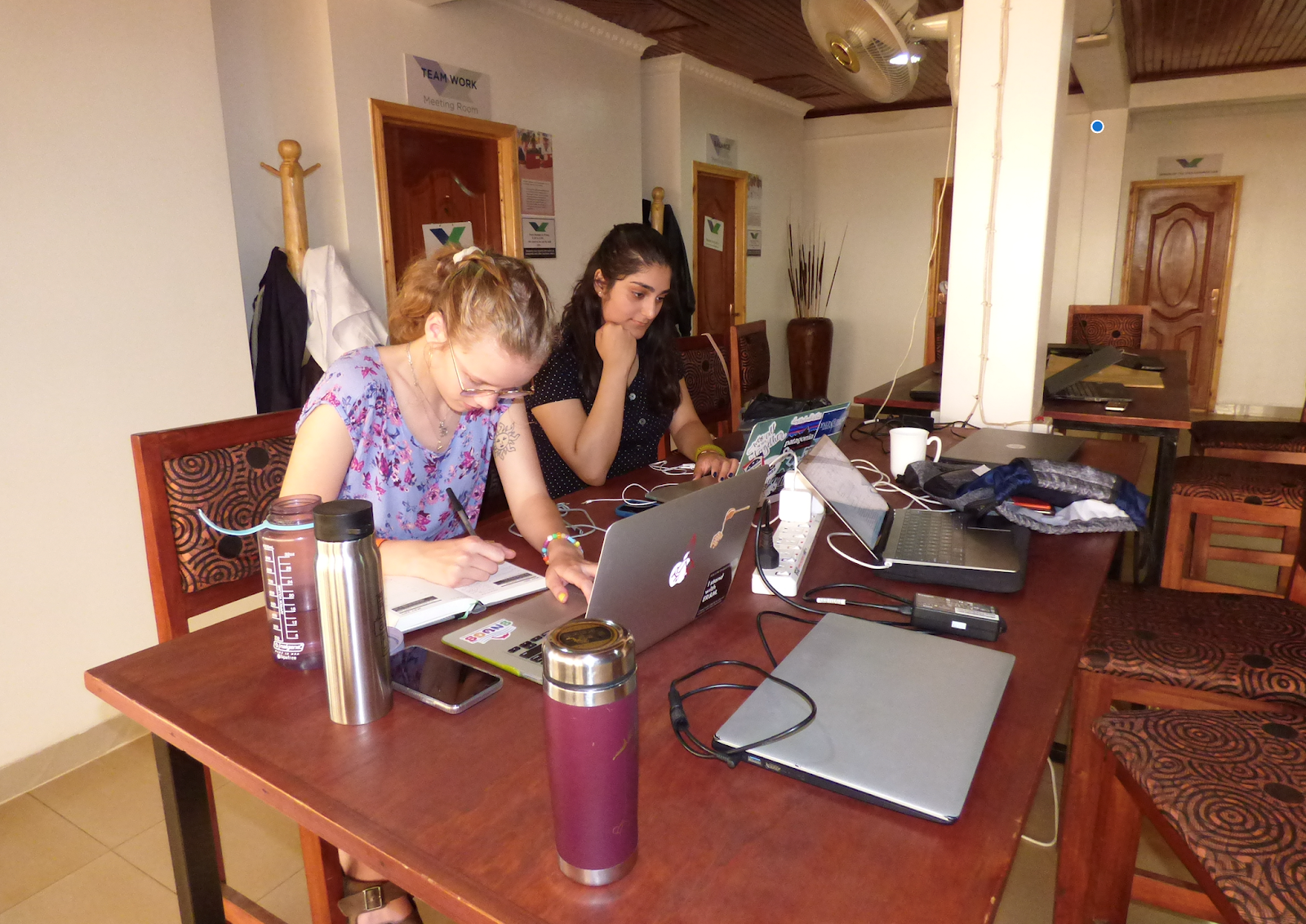 Willow Sylvester and Ananya Kachru working in the Kepler Kigali office space. 