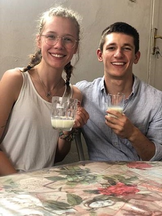 Kepler teammates Willow Sylvester and Zodi Chalat at a milk bar, which is a part of Rwandan culture